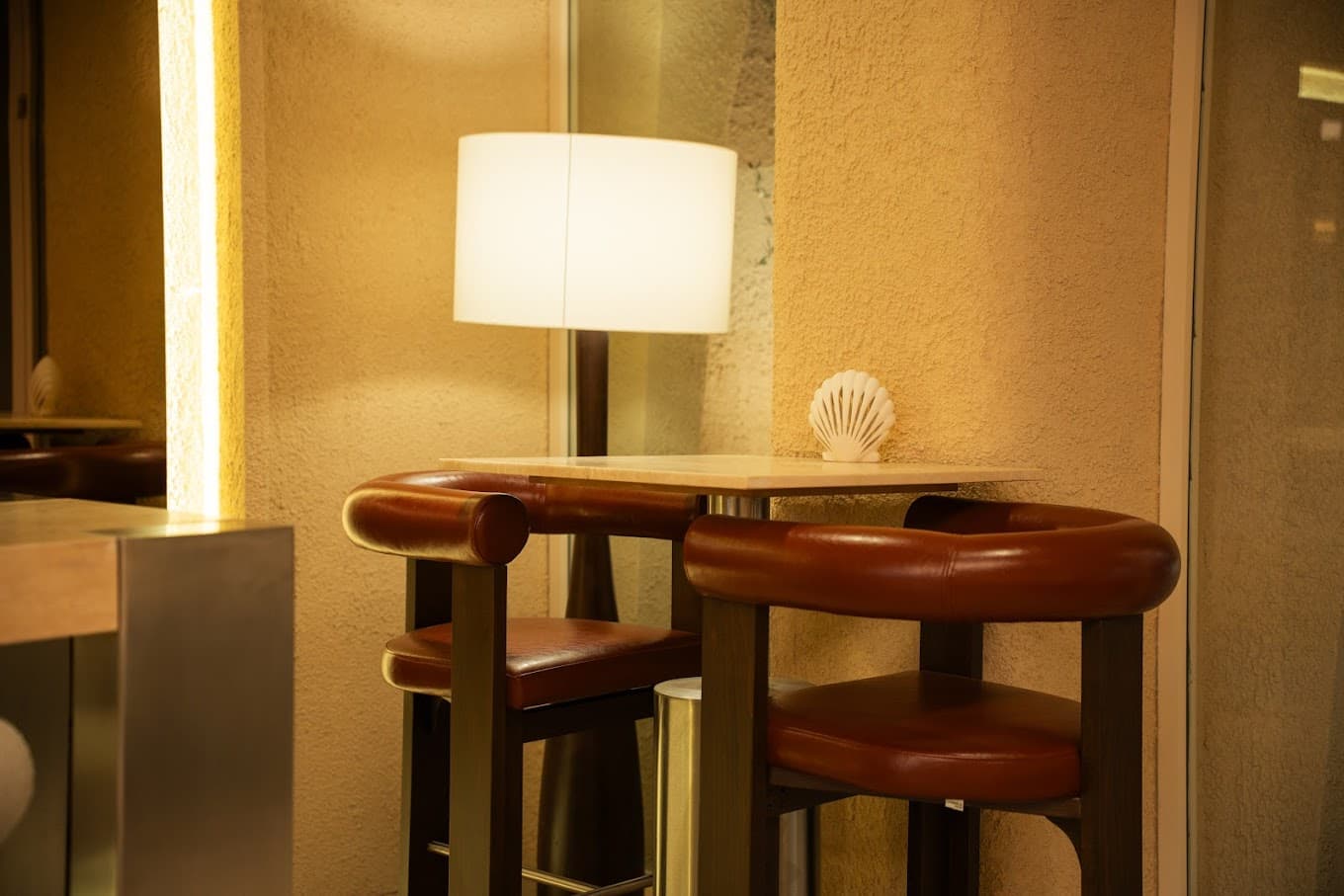Leather bar stools and lamp detail